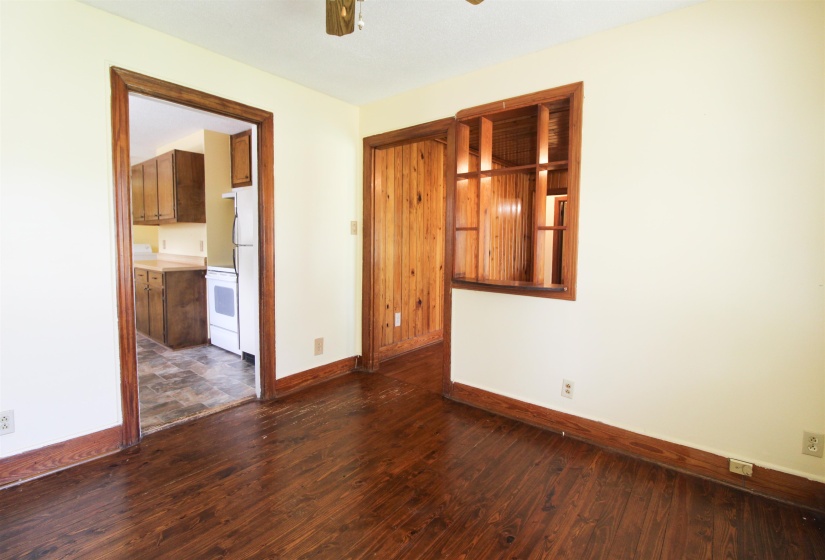 Formal Dining Room featuring dark wood finished floors, ceiling fan, and a textured ceiling