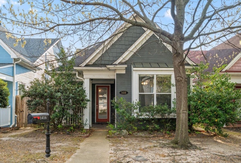 View of front facade with roof with shingles