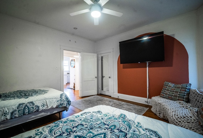 Bedroom featuring wood finished floors and a ceiling fan