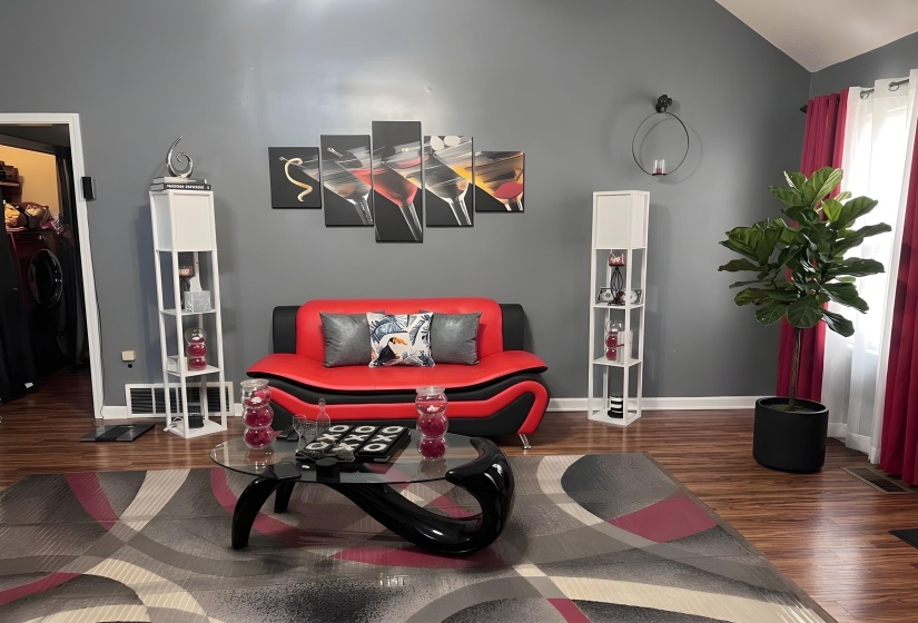 Great Room with vaulted ceiling and healthy amount of natural light