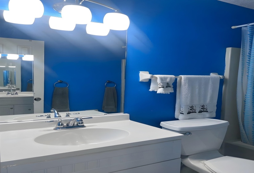Bathroom featuring vanity and shower / bath combo