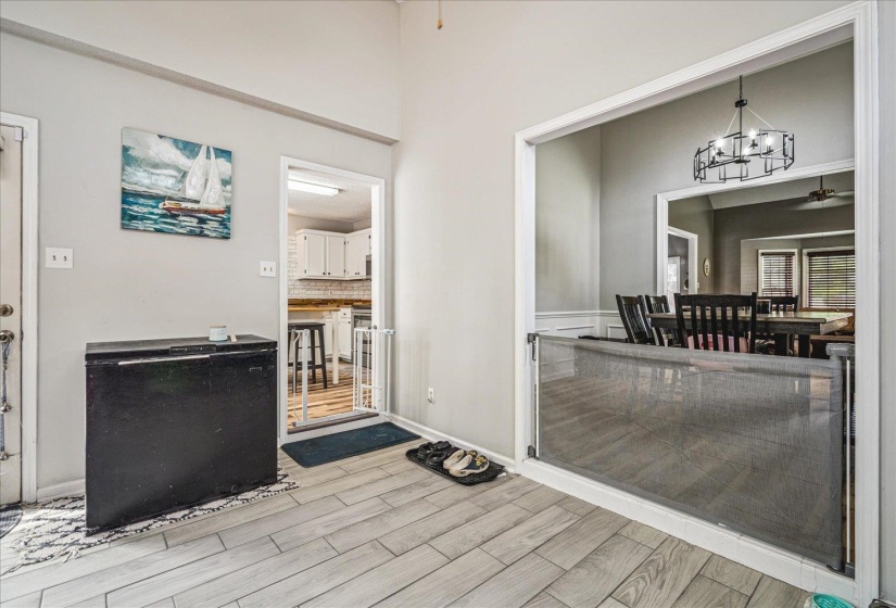 Interior space with a chandelier and a ceiling fan