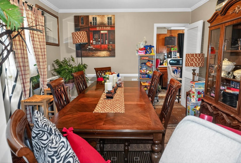 Dining area featuring ornamental molding
