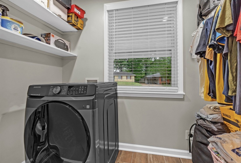 Laundry area featuring light wood-type flooring and washer hookup