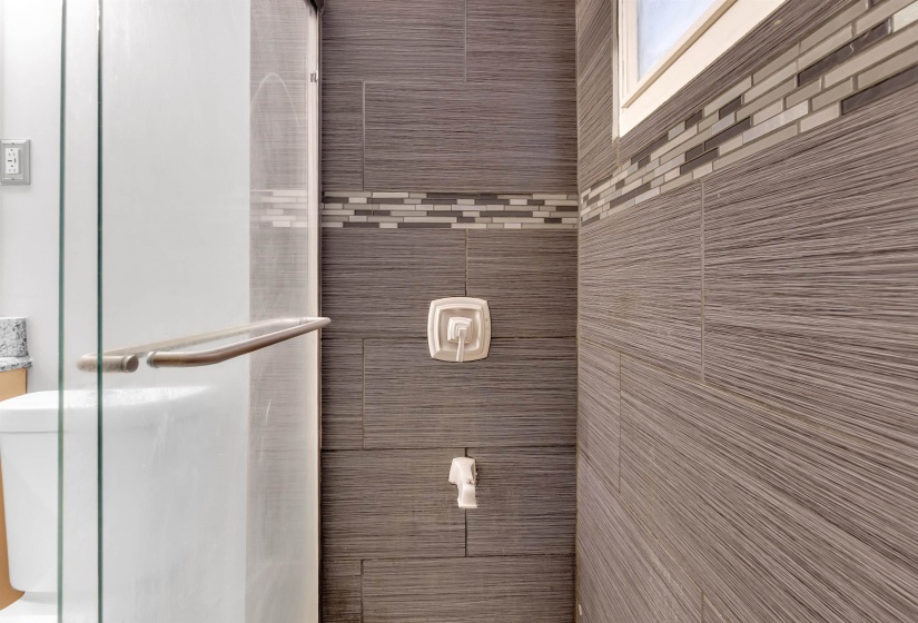 Bathroom featuring a tile shower