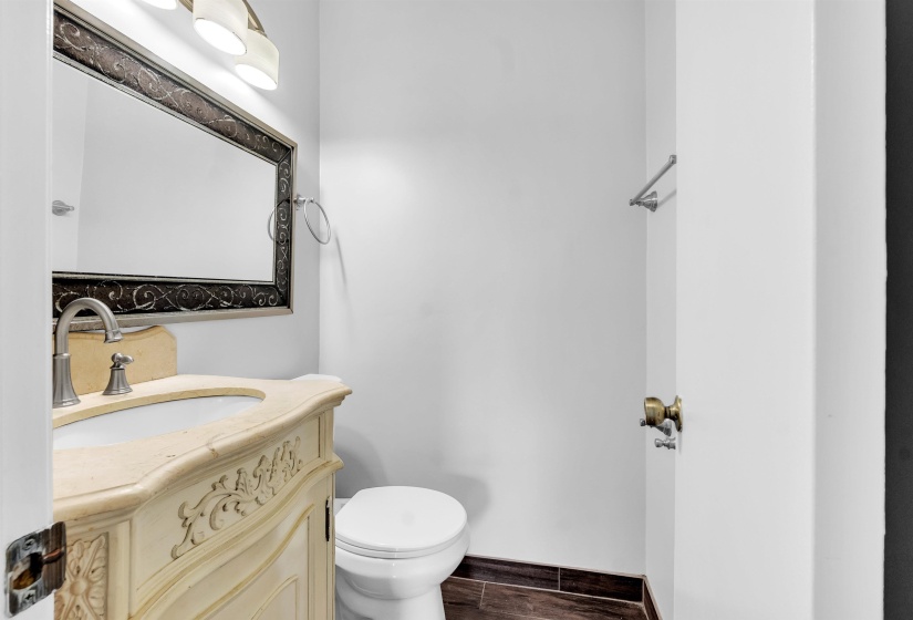 Bathroom featuring vanity and wood tiled floors