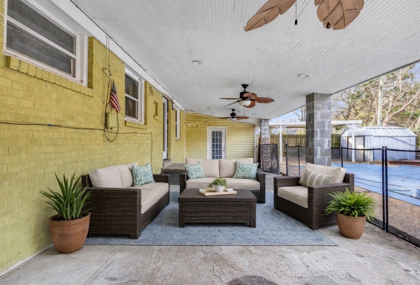 View of patio / terrace with ceiling fan, an outdoor lounge area, and an outdoor structure