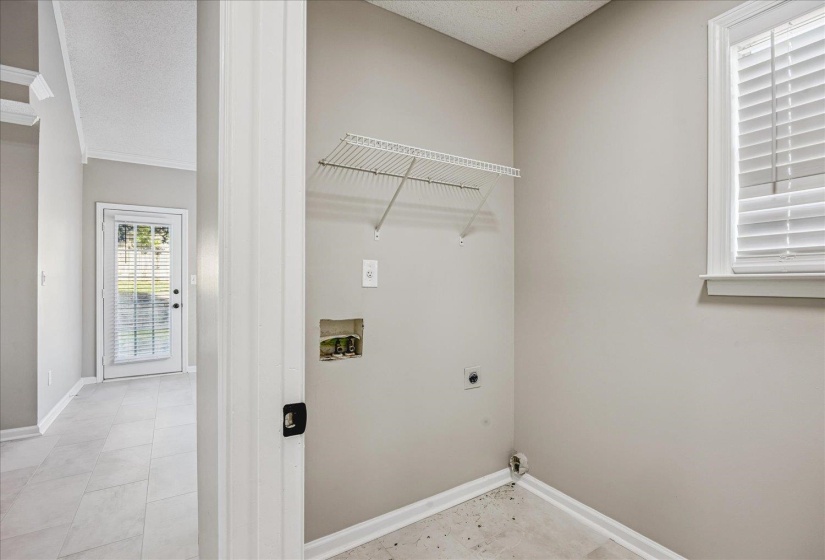 Laundry area featuring washer hookup, electric dryer hookup, and a textured ceiling