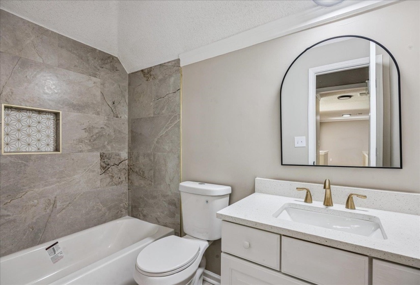 Bathroom featuring vanity and shower / tub combination