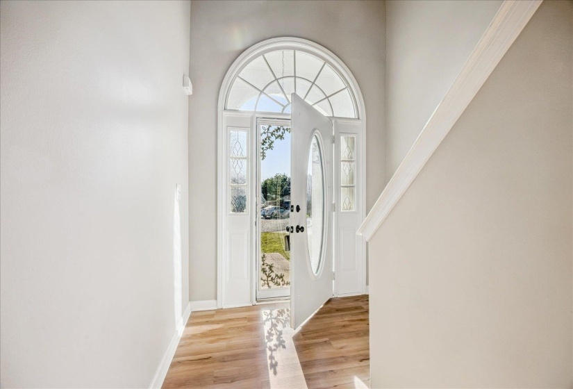Foyer featuring light wood-type flooring and baseboards