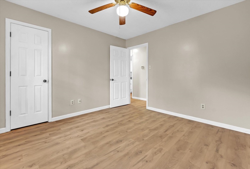 Unfurnished bedroom featuring light wood-style flooring and a ceiling fan