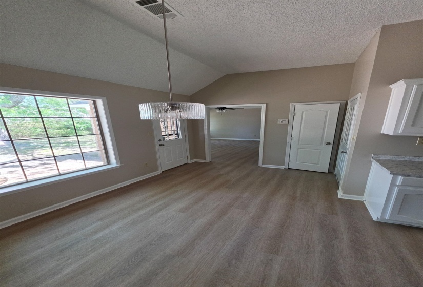 Breakfast Room area featuring a chandelier, ceiling fan, and dark wood finished floors