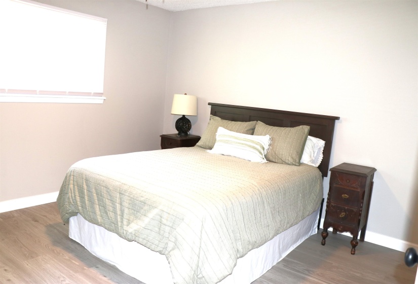 Bedroom with wood finished floors