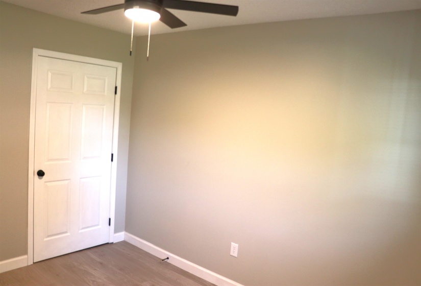 Spare room featuring light wood-type flooring and ceiling fan