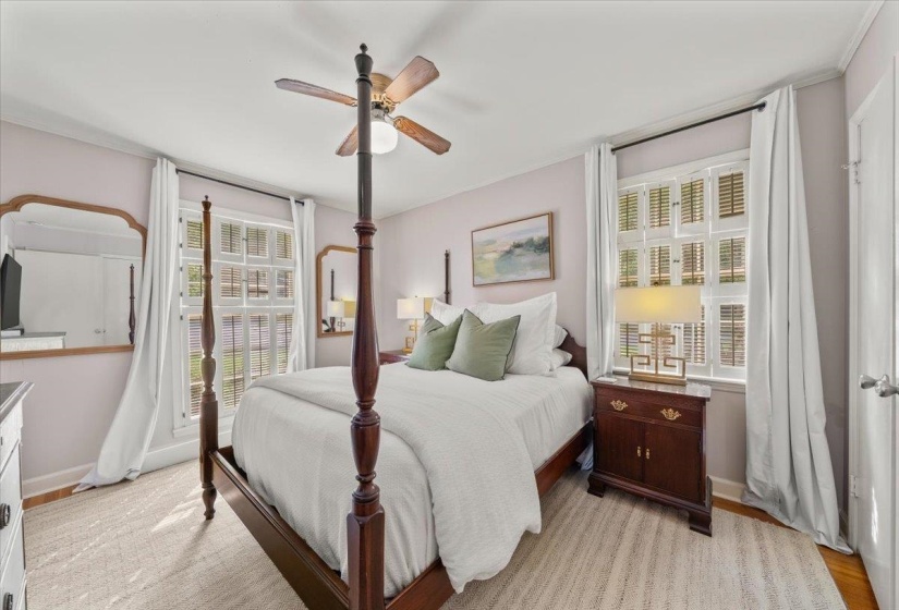 Bedroom with ceiling fan and light wood finished floors