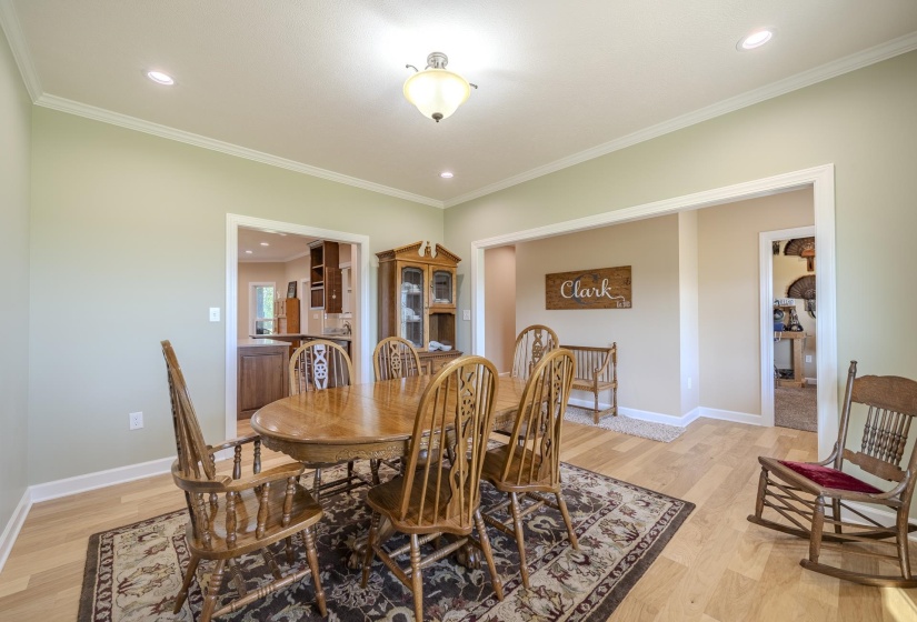 Dining room featuring recessed lighting, light wood finished floors, and crown molding