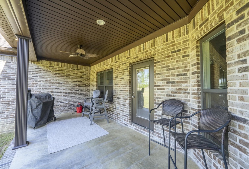 View of patio with a ceiling fan and a grill