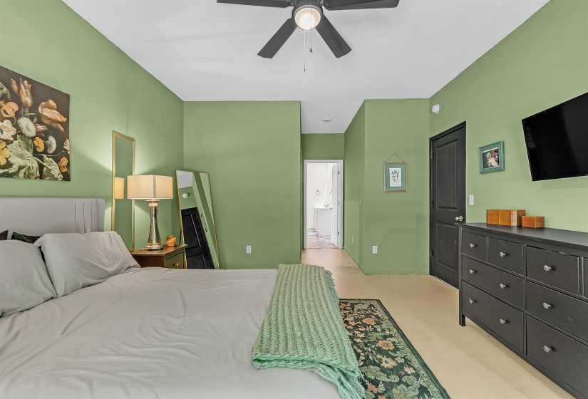 Bedroom with ensuite bath and ceiling fan