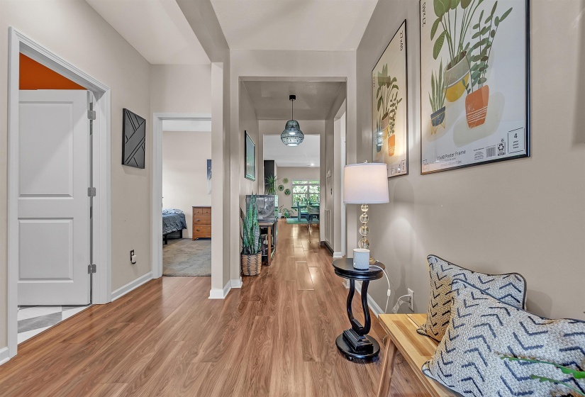 Hall featuring light wood-style floors and baseboards