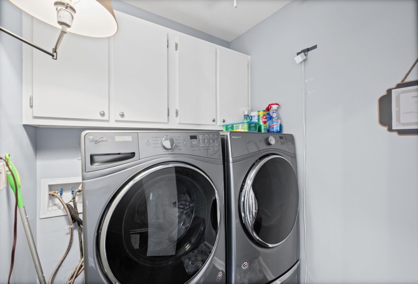 Laundry room featuring cabinet space and washing machine and dryer