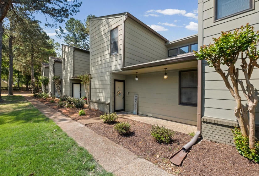 View of side of property with a yard