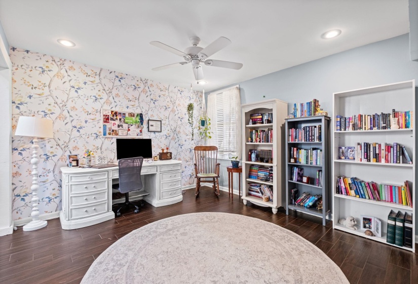 Office area featuring wallpapered walls, wood finish floors, ceiling fan, an accent wall, and recessed lighting