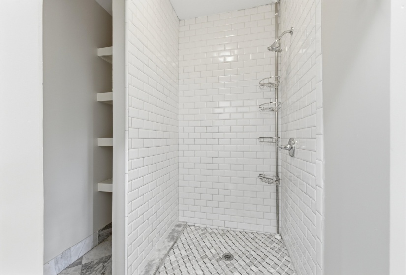 Full bathroom featuring a stall shower
