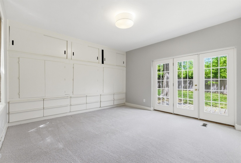 Unfurnished bedroom with access to exterior and light colored carpet