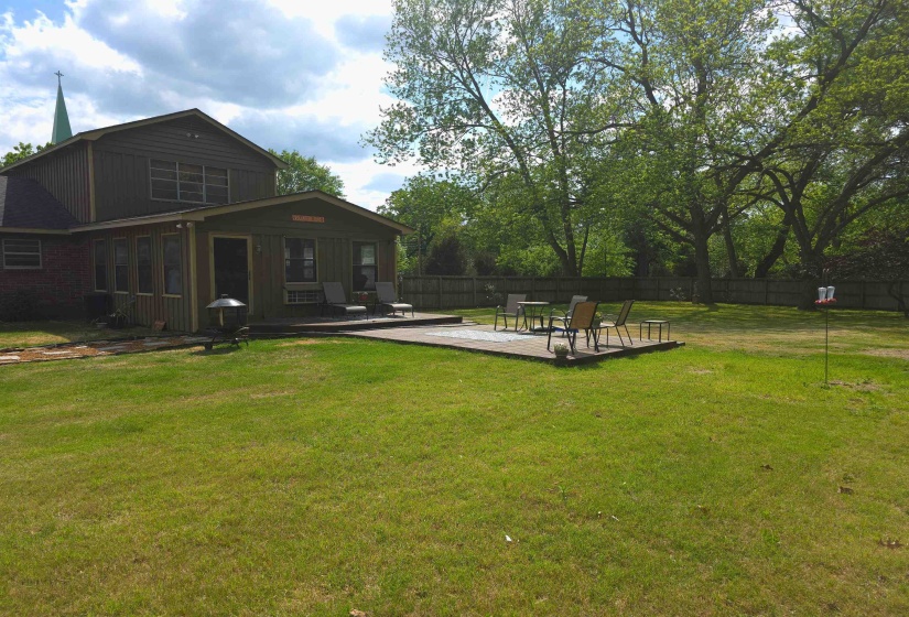 Fenced backyard with a patio