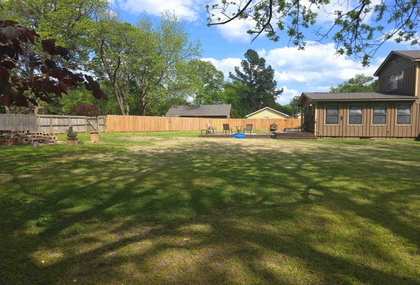 Fenced backyard with a wooden deck