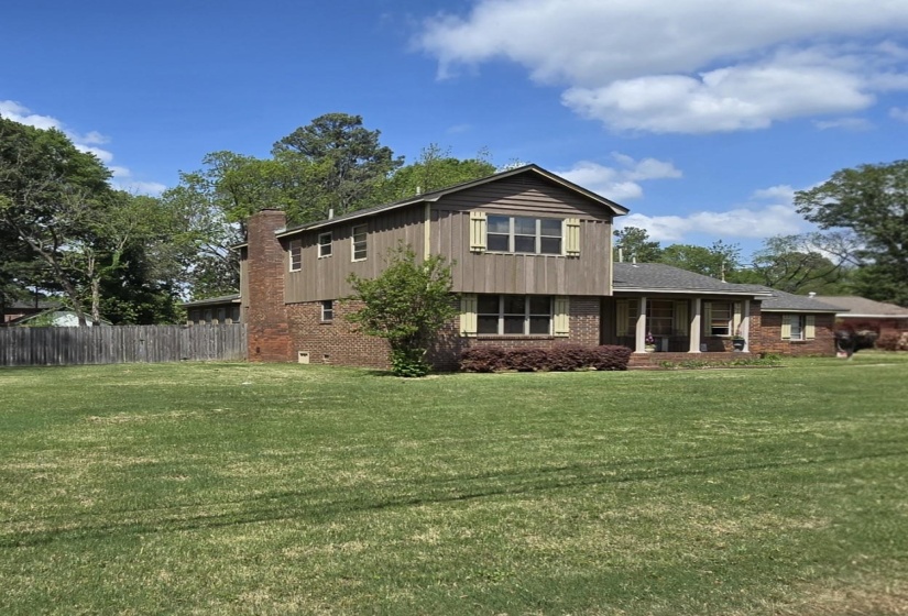 View of front facade featuring brick siding