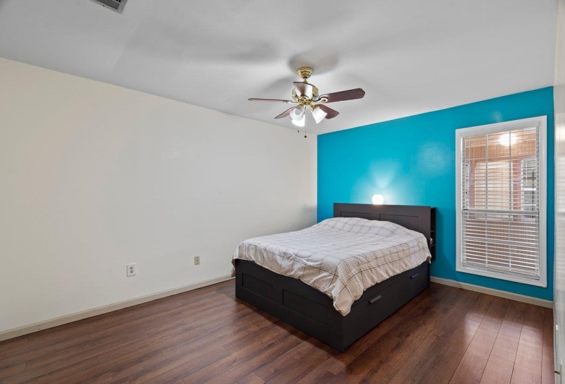 Bedroom featuring dark wood finished floors and ceiling fan