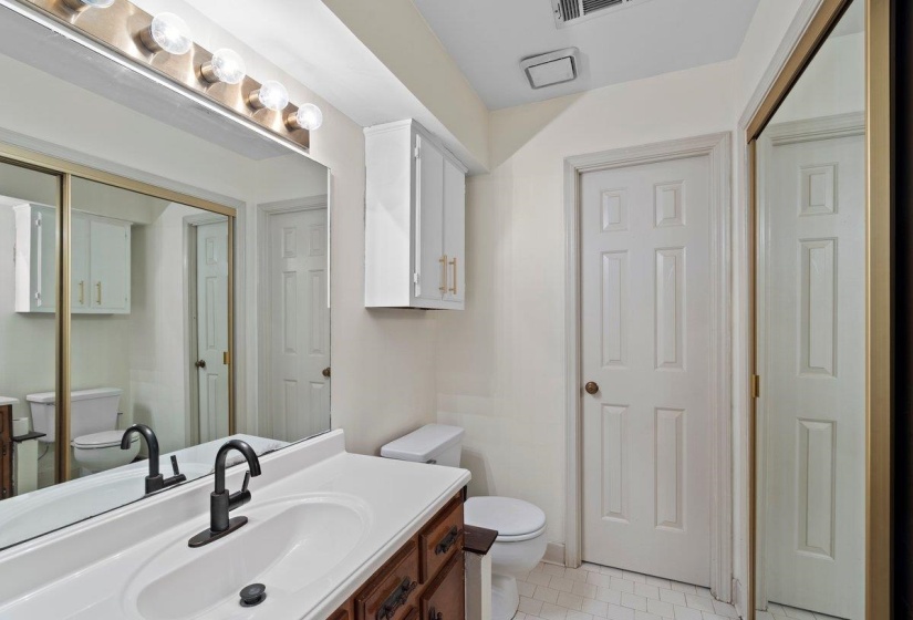 Bathroom with toilet and vanity