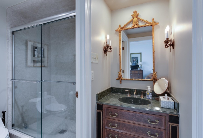 Full bath featuring vanity and a stall shower