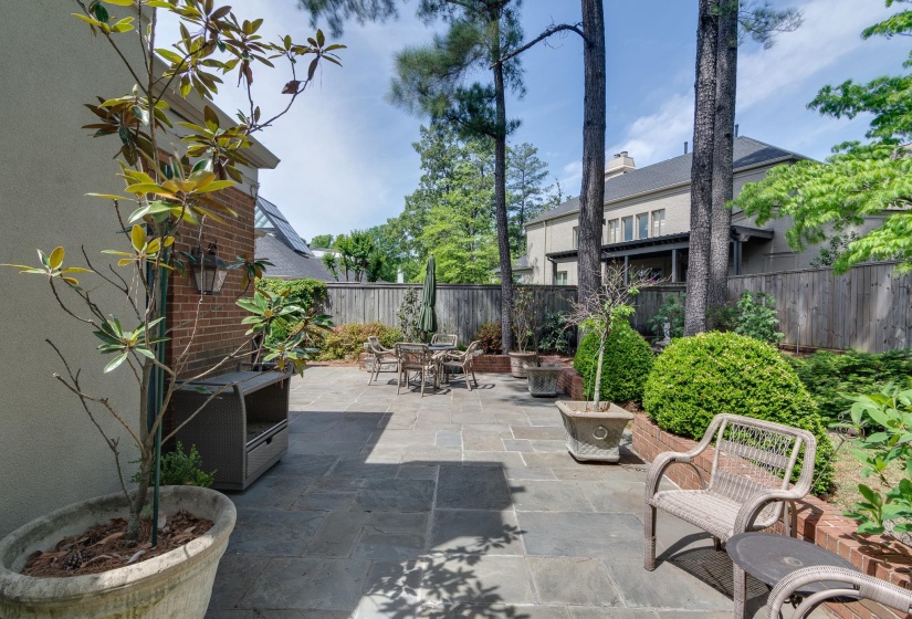 Fenced backyard with a patio and outdoor dining space