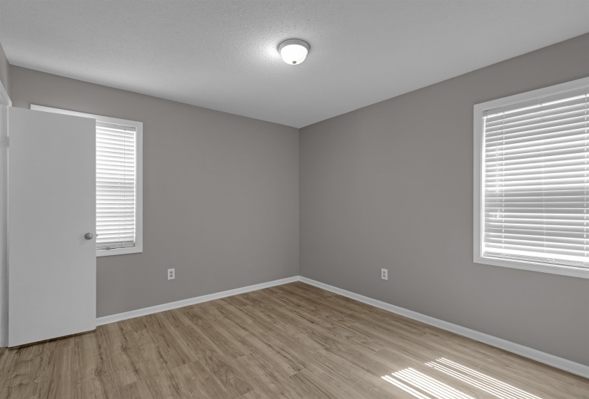Empty room featuring light wood-style floors and baseboards