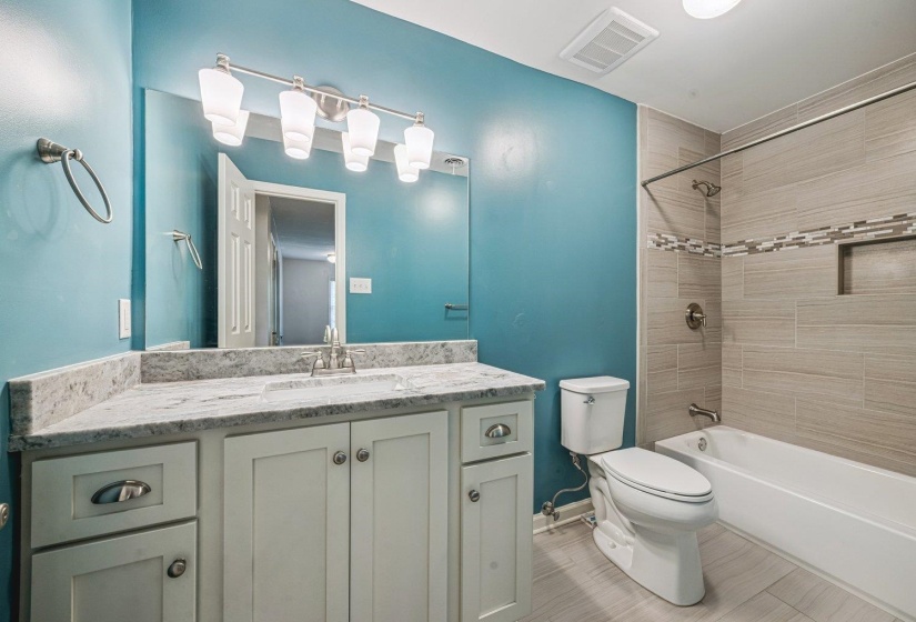 Full bathroom featuring vanity and shower / washtub combination
