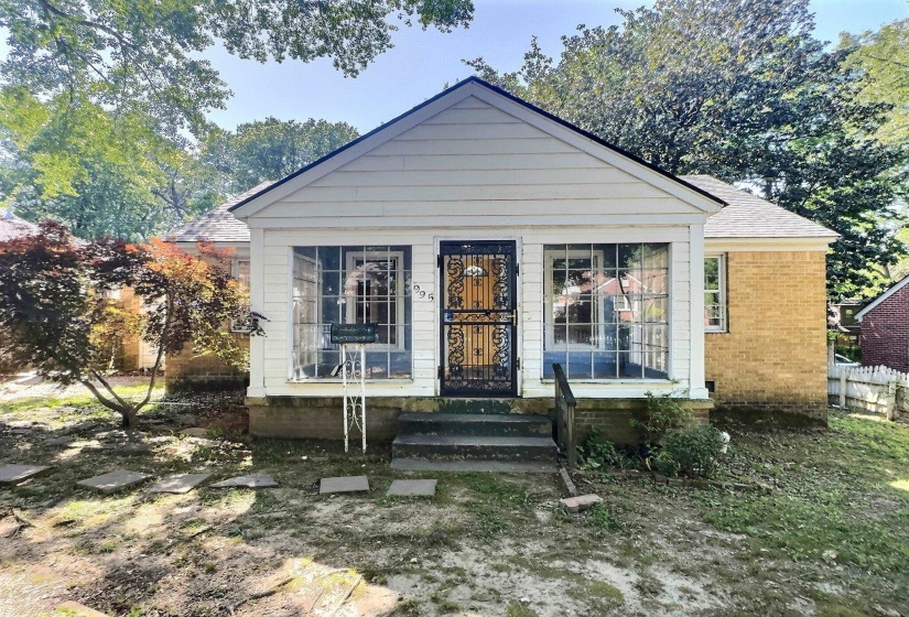 Bungalow-style home with roof with shingles