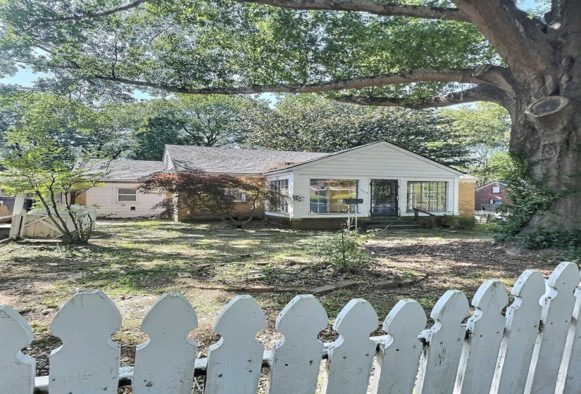 Bungalow-style home featuring a fenced front yard