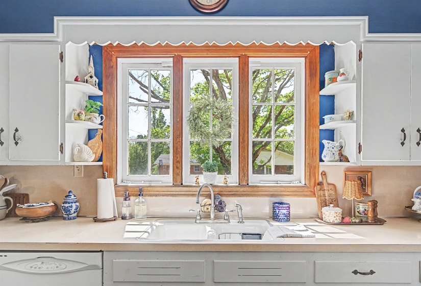Kitchen with open shelves and white cabinets