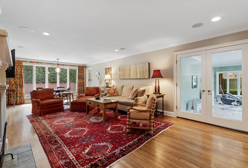22x14 Den Featuring Gas Starter Fireplace Framed by Built-In Bookcase  and Custom Entertainment Center