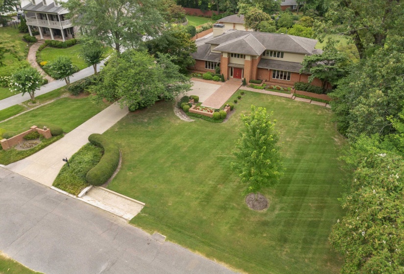 Beautiful One-Acre Estate Featuring Mature Trees, Lush Landscaping, and Expansive Outdoor Living Areas, Offering Privacy, Tranquility, and Plenty of Space for Relaxation and Entertaining.