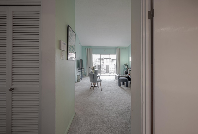Corridor featuring carpet