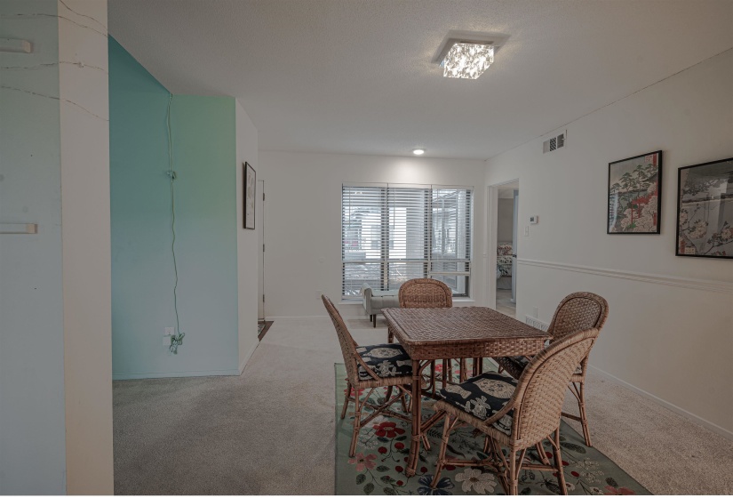 Dining space with light carpet