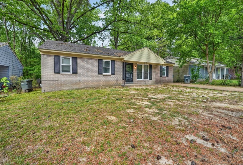 Ranch-style home featuring brick siding and a front yard