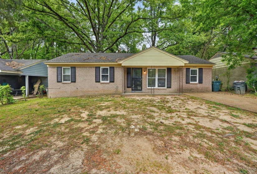 Single story home featuring brick siding and roof with shingles