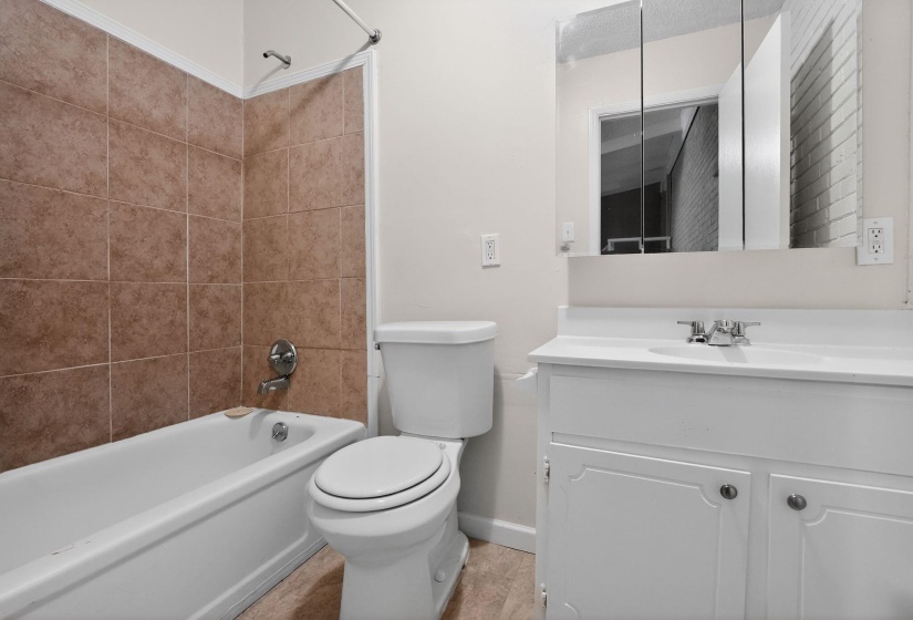 Full bathroom featuring vanity and shower / washtub combination