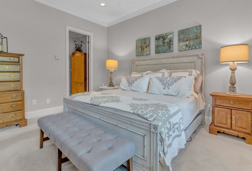 Bedroom featuring crown molding, recessed lighting, and light carpet