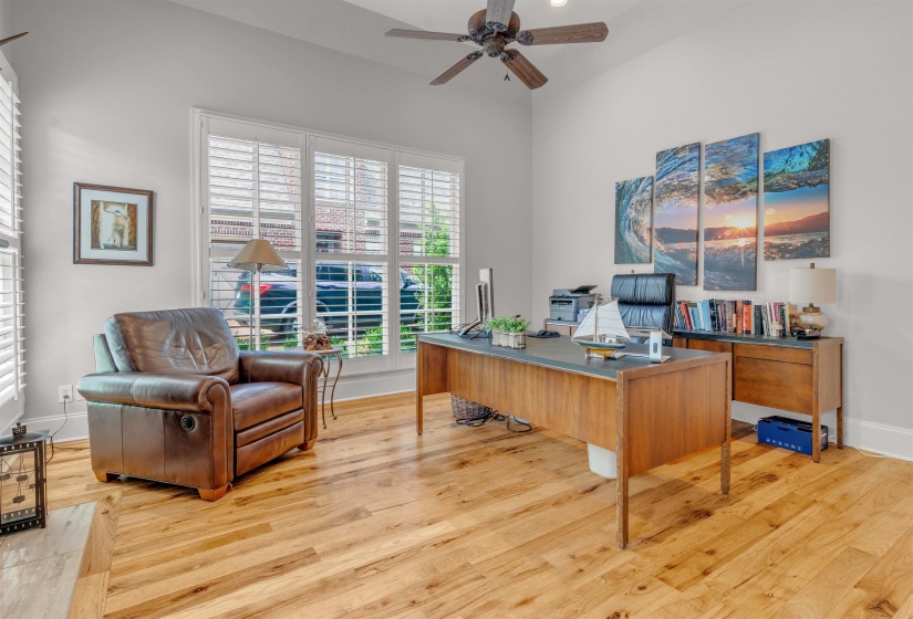 Office space featuring ceiling fan and light wood finished floors