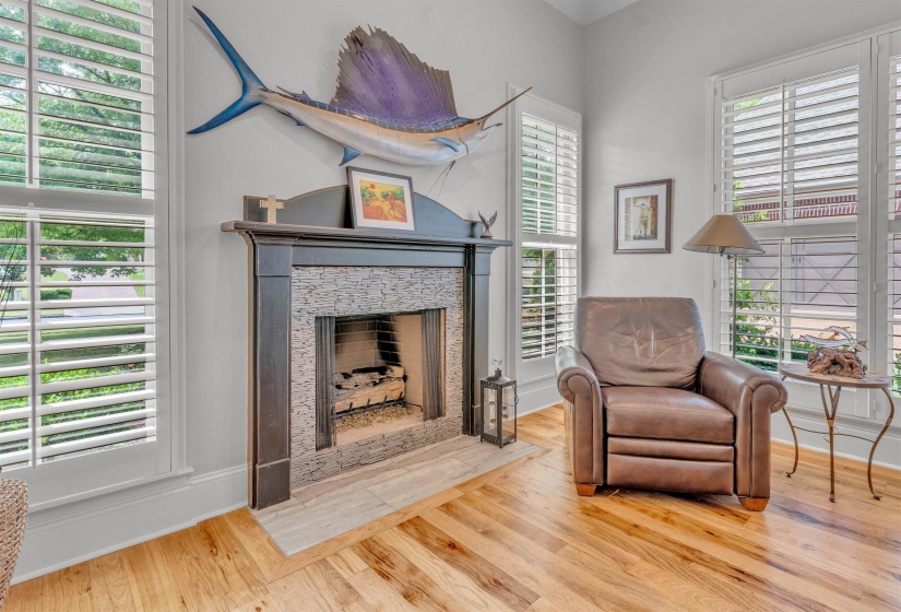 Sitting room featuring light wood-type flooring and a fireplace